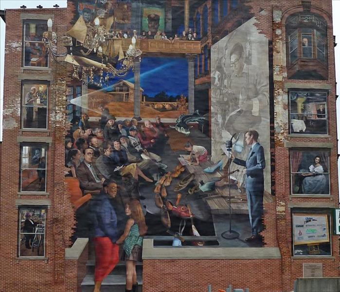 Photo of the Essex Street Gateway Community Mural. Audio tour of the mural can be found from the linked article above.